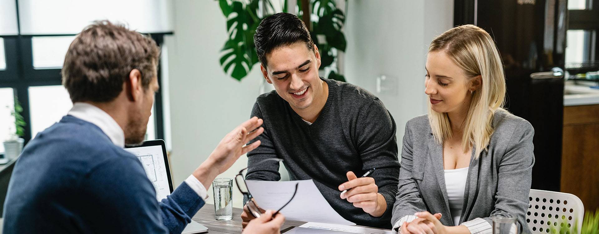 A couple having meeting with a property expert